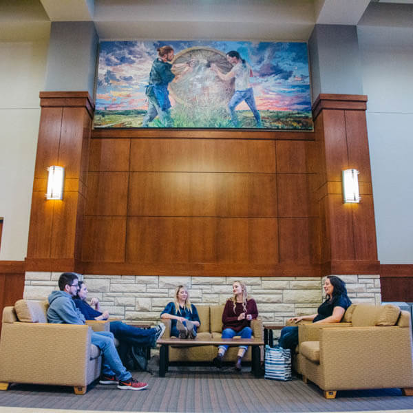 Students chatting in the hall of Memorial Union