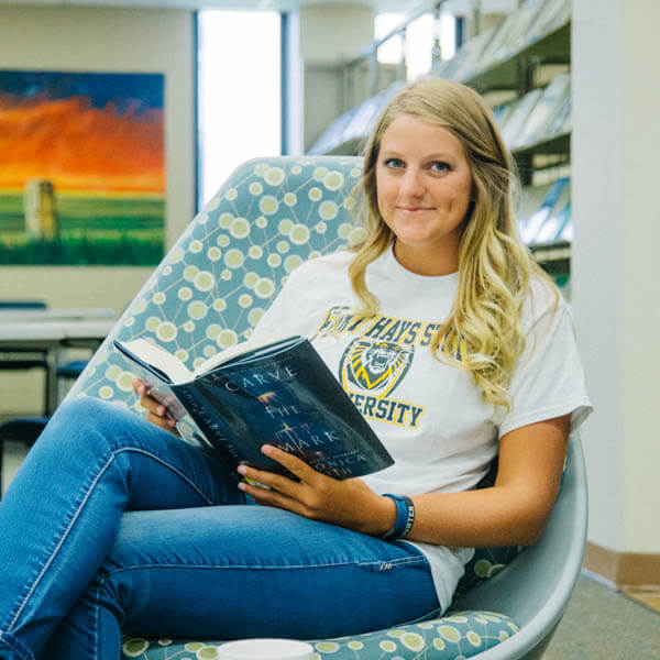 a student reading in Forsyth Library