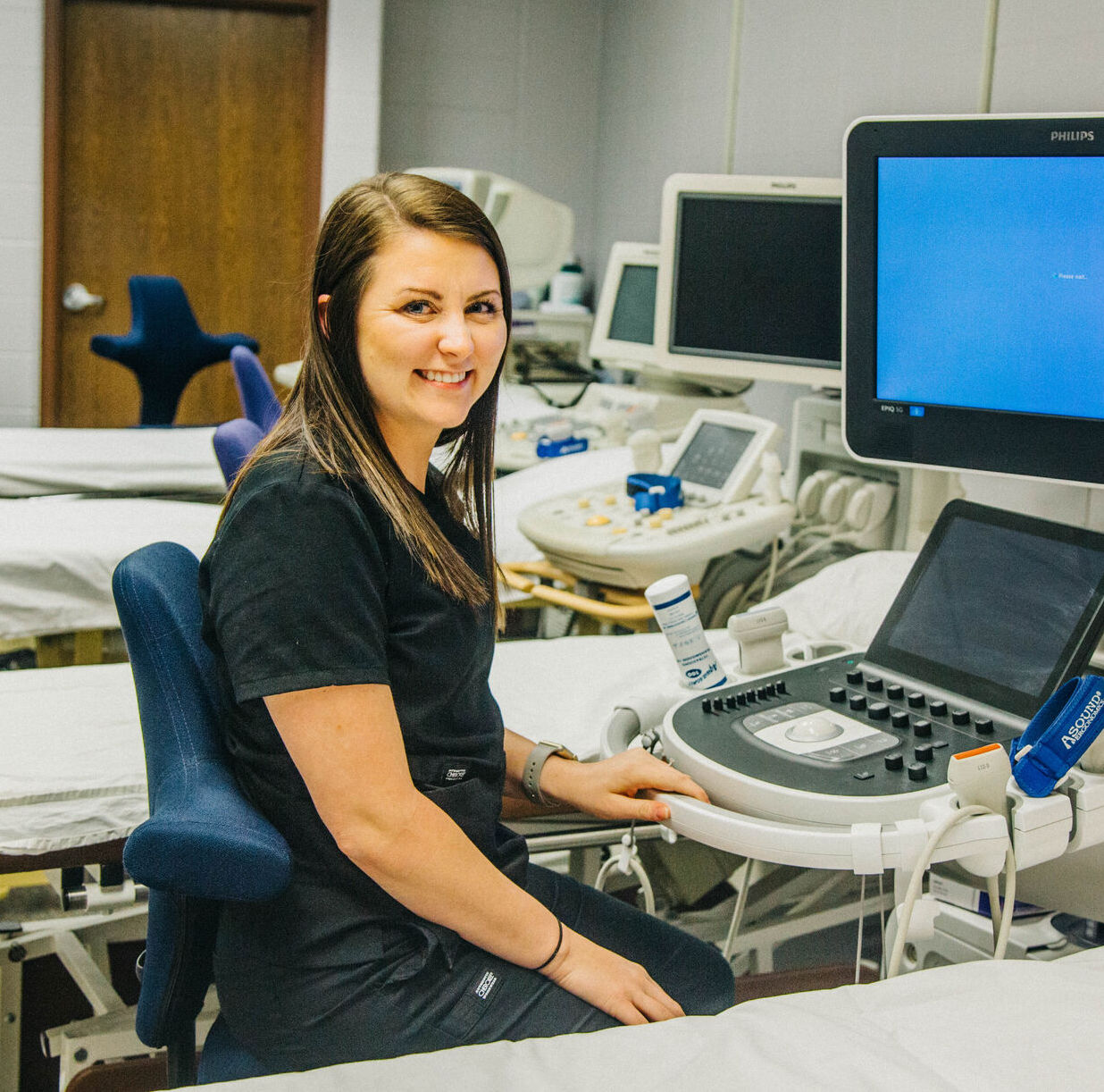 mentors of Department of Health and Behavioral studies checking hearing disorder with a kid 2