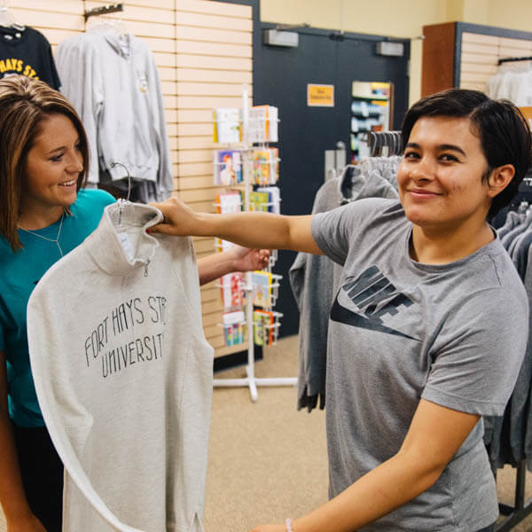 students purchasing FHSU clothes at Tiger Spirit Shop