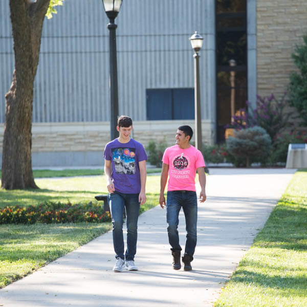 two students walking on campus