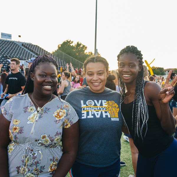 students cheering in FHSU Levis Track & Field