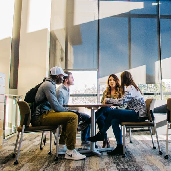 students sitting and chatting together