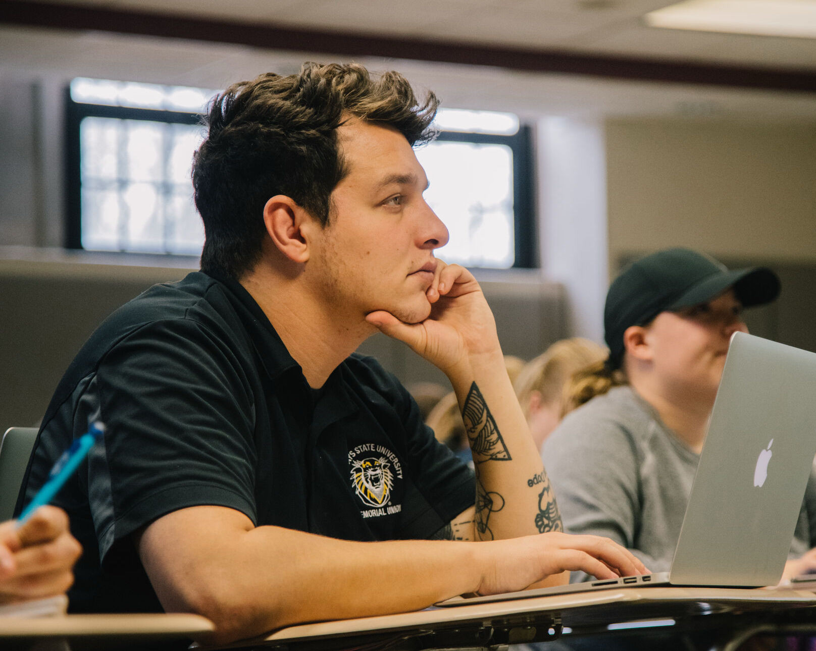 a student taking notes in class