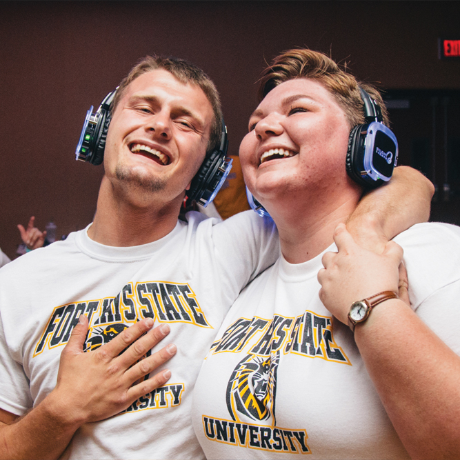 two students singing together