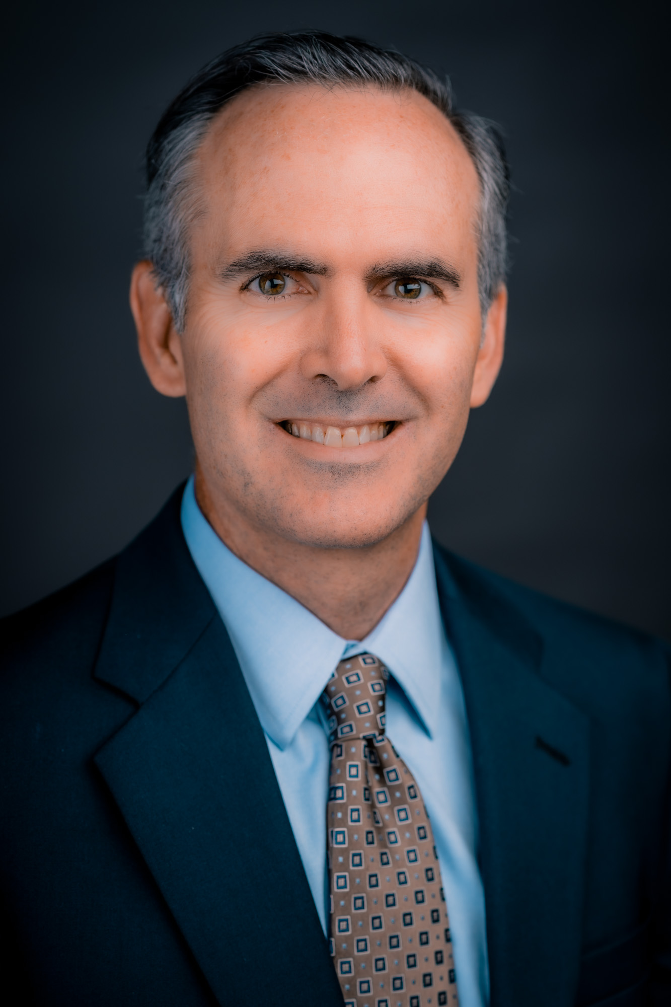 headshot of Brett Zollinger