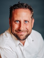 headshot of Greg Atkins