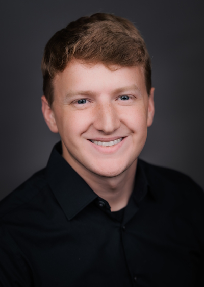 headshot of Les Mackey