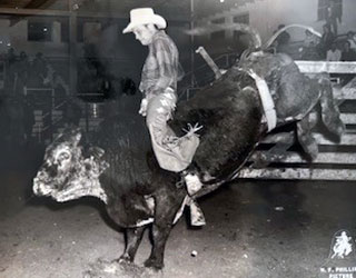 photograph of Neil Barstow riding a bull