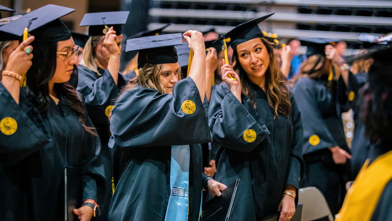 undergraduates turning tassels