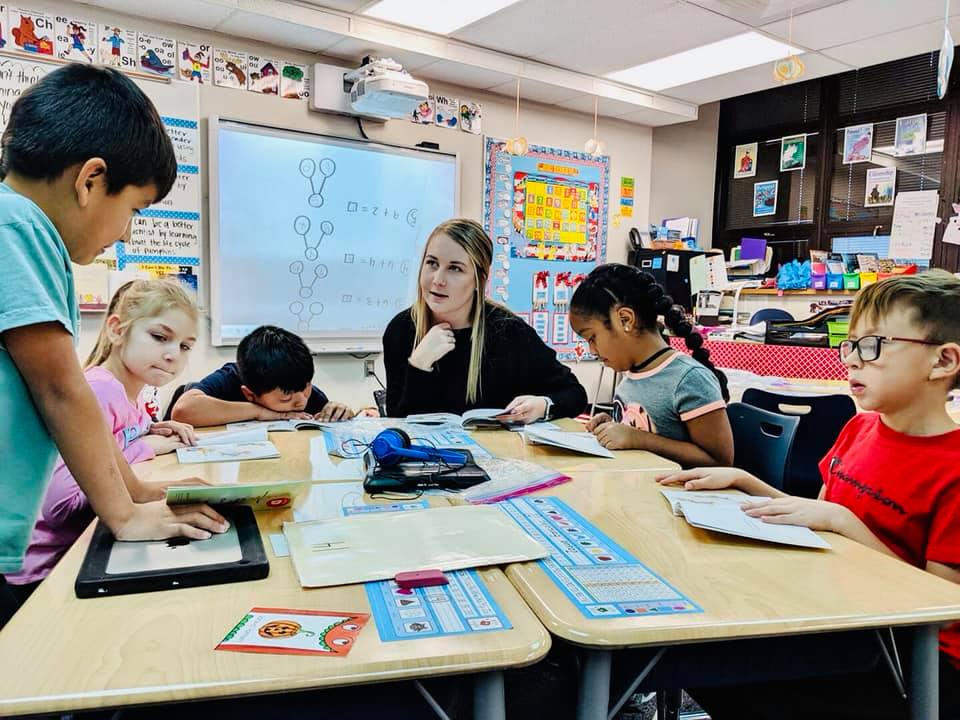 Fort Hays State’s Michaela Strecker, Minneola senior, works with elementary education students during a school visit to Dodge City earlier this semester.