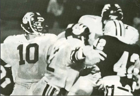 Quarterback Jeff Miller looks for an open receiver during his playing days at FHSU in the mid- to late-1980s.