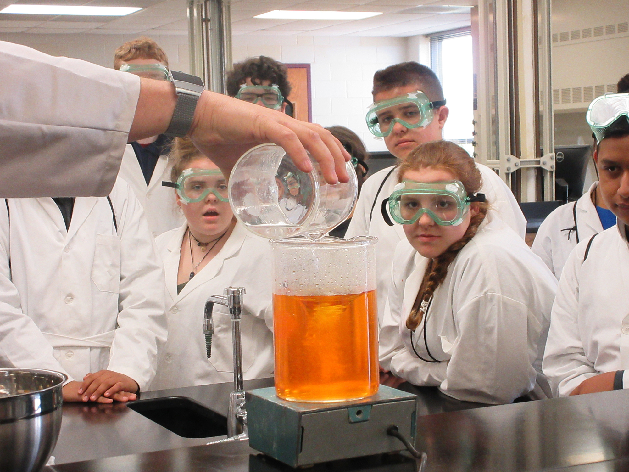 Kansas Academy of Math and Science camp participants observe science experiments at the 2019 summer camp.