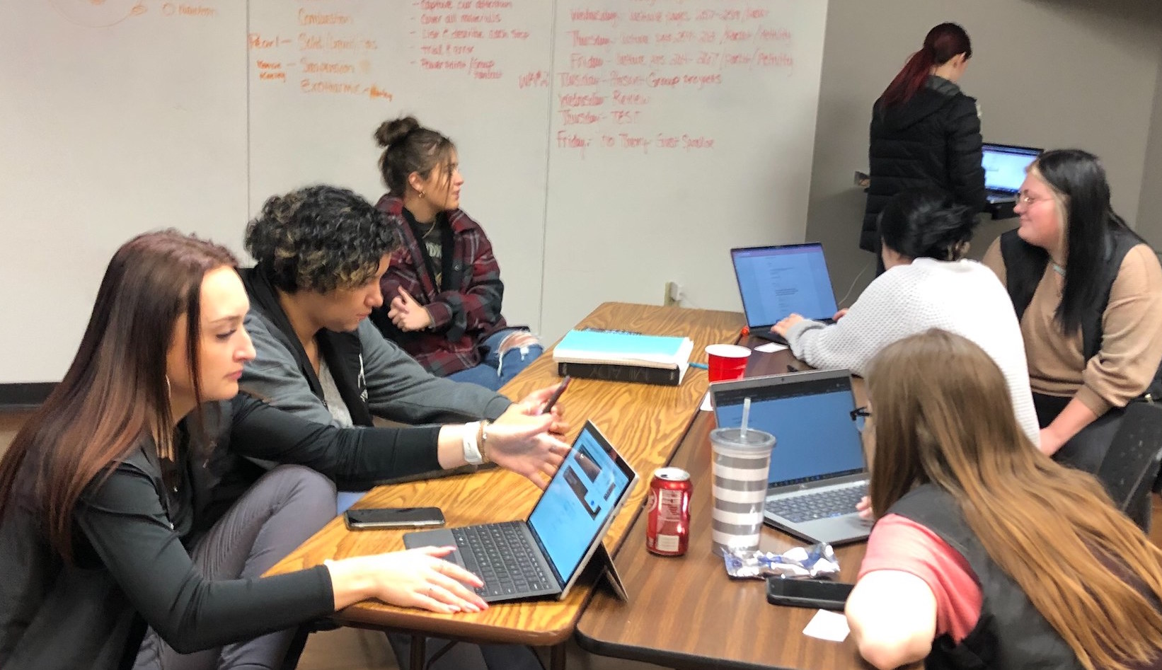 Students from Hays Academy of Hair Design enroll in the inaugural class of a partnership between the academy and Fort Hays State University.