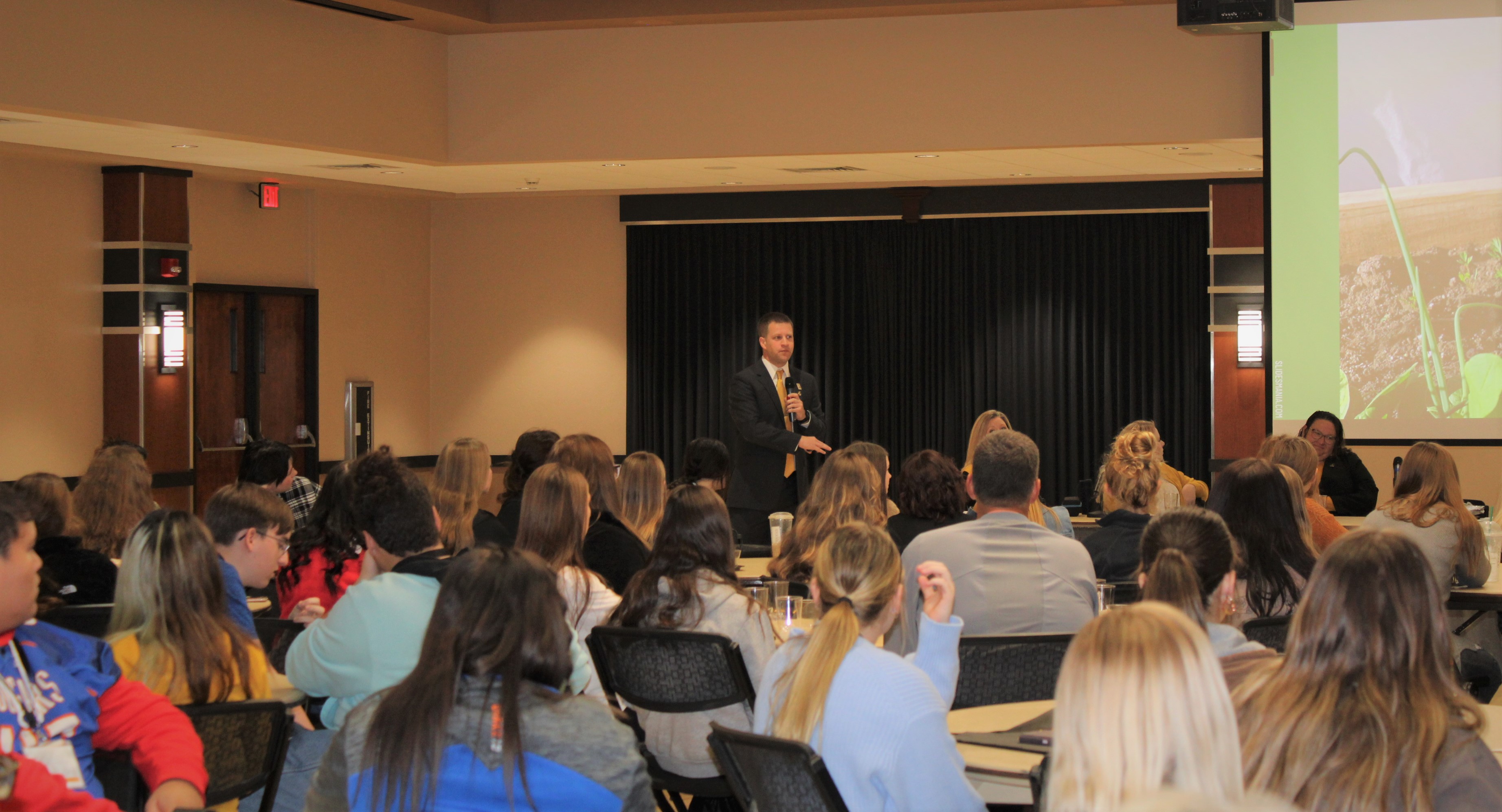 Kansas Teacher of the Year Brian Skinner speaking to full house of future educators