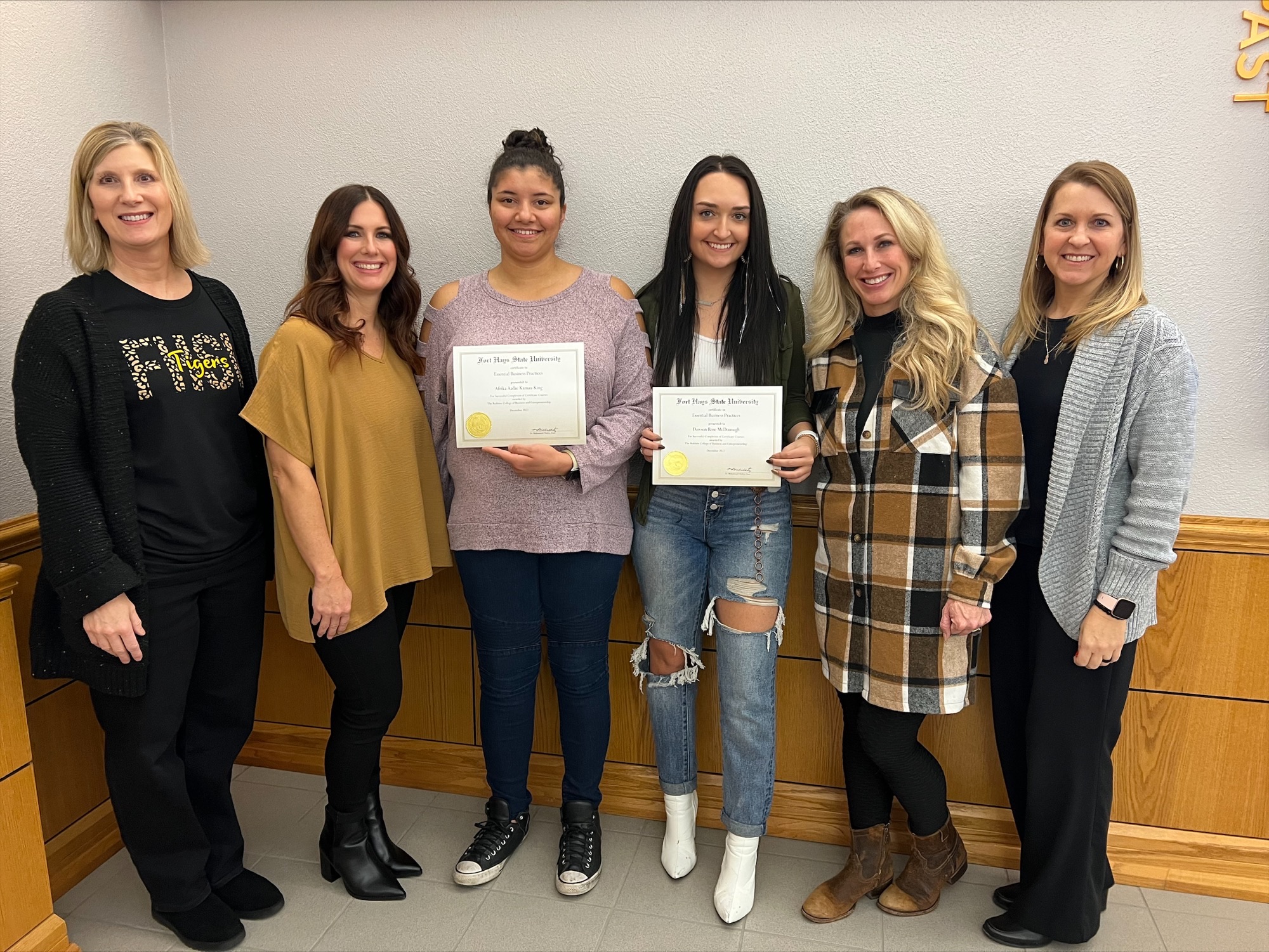 From left - Mary Martin, FHSU Marketing instructor; Summer Melvin, HAHD Owner; Afrika Aadae NZingha Kamau-King, Certificate graduate; Dawson McDonough, Certificate graduate; Danielle Markley, HAHD Owner; Stacey Smith, FHSU Certificate Coordinator