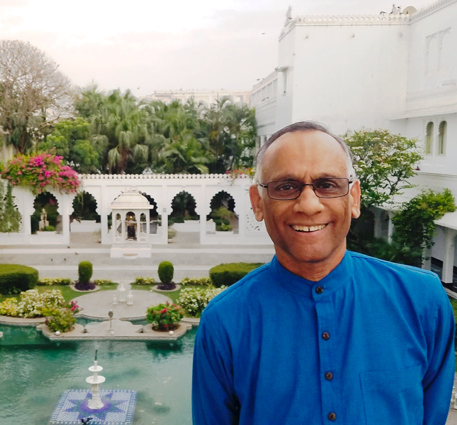 Sinha poses in front of the Taj Lake Palace in India