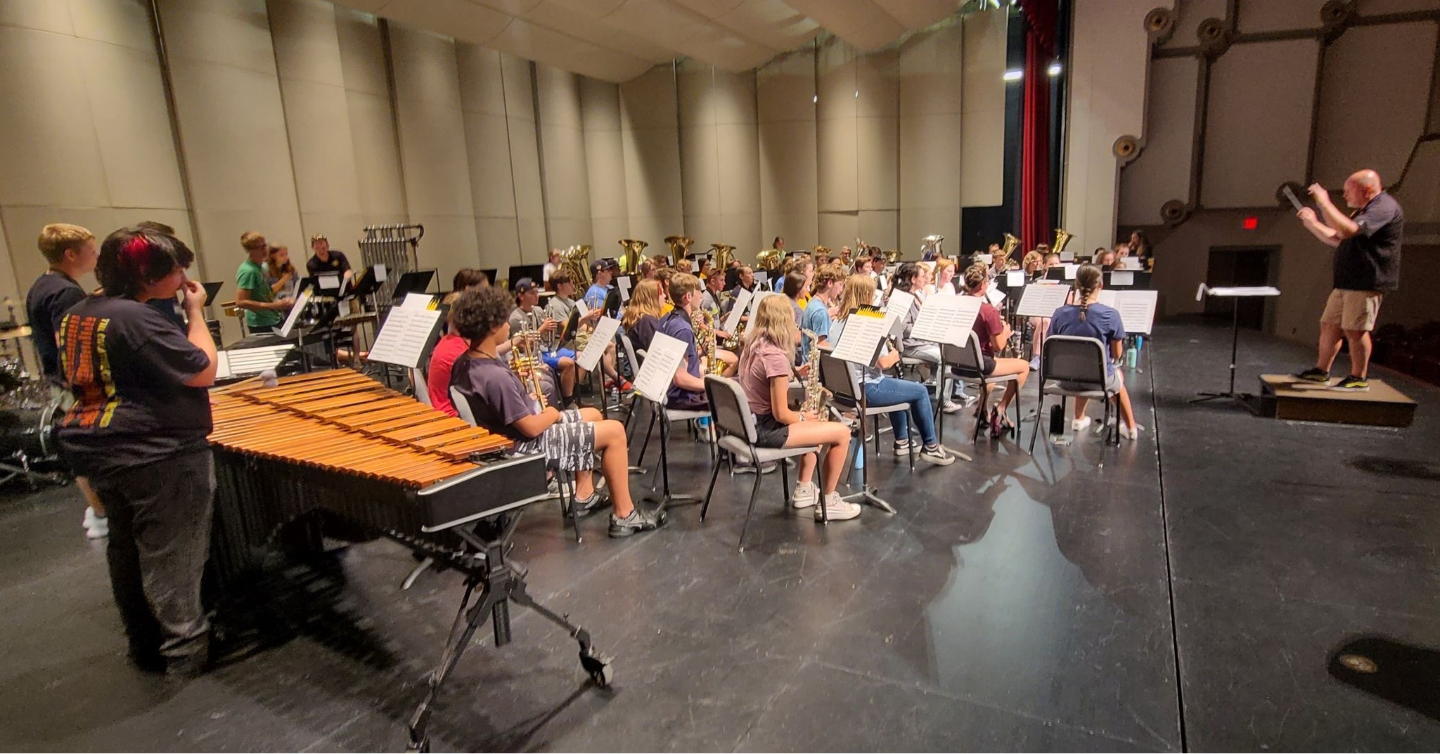 Large ensemble rehearsal for High Plains Music Camp in Beach Schmidt Performing Arts Center under the direction of Dr. Peter Lillpopp