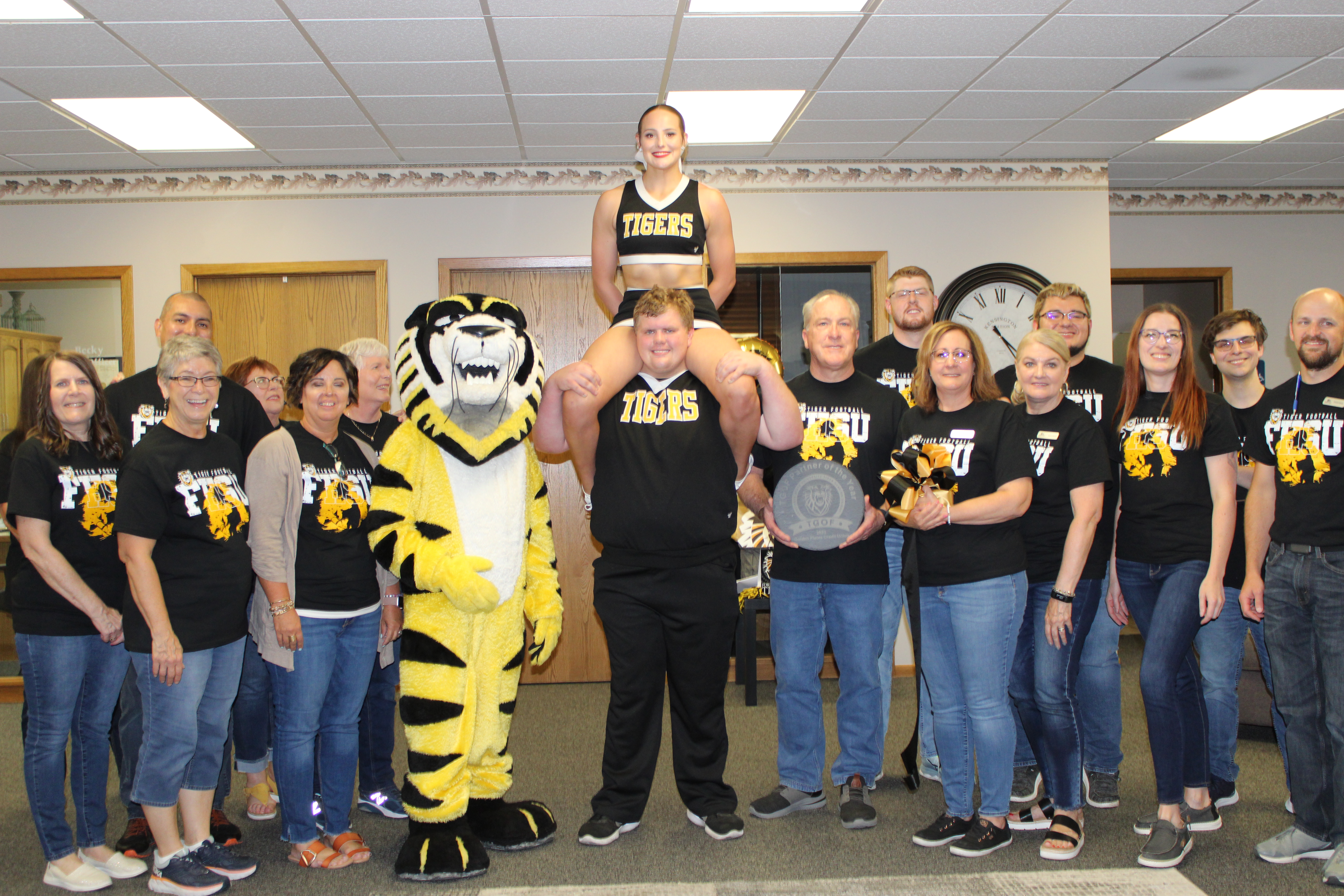 Victor E. Tiger and FHSU cheerleaders celebrate with TGOF Partner of the Year, Golden Plains Credit Union