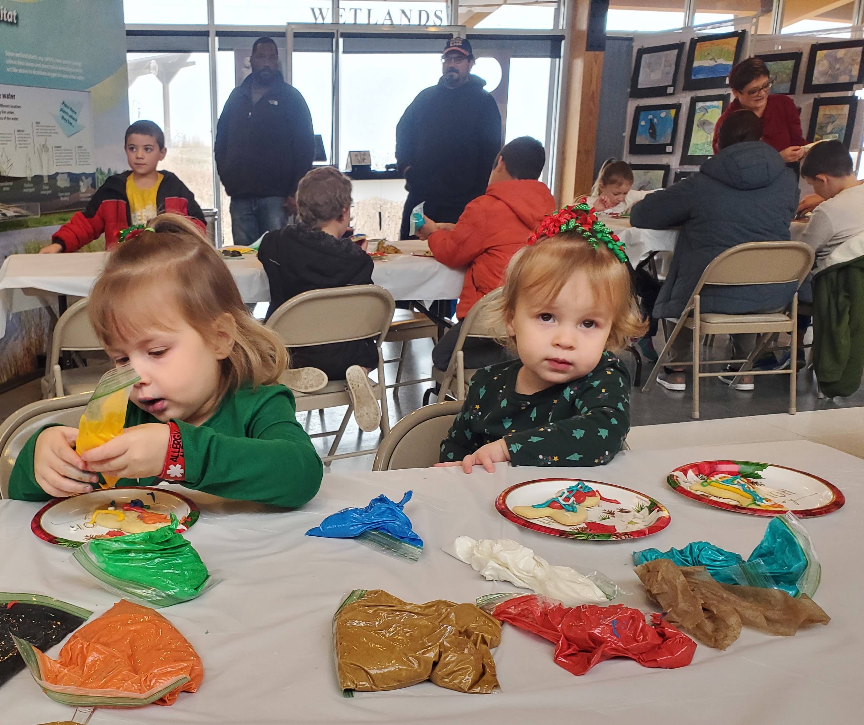 Visitors to KWEC's annual Holiday Open House will be able to decorate a bird shaped sugar cookie and create a pressed flower ornament to take home.
