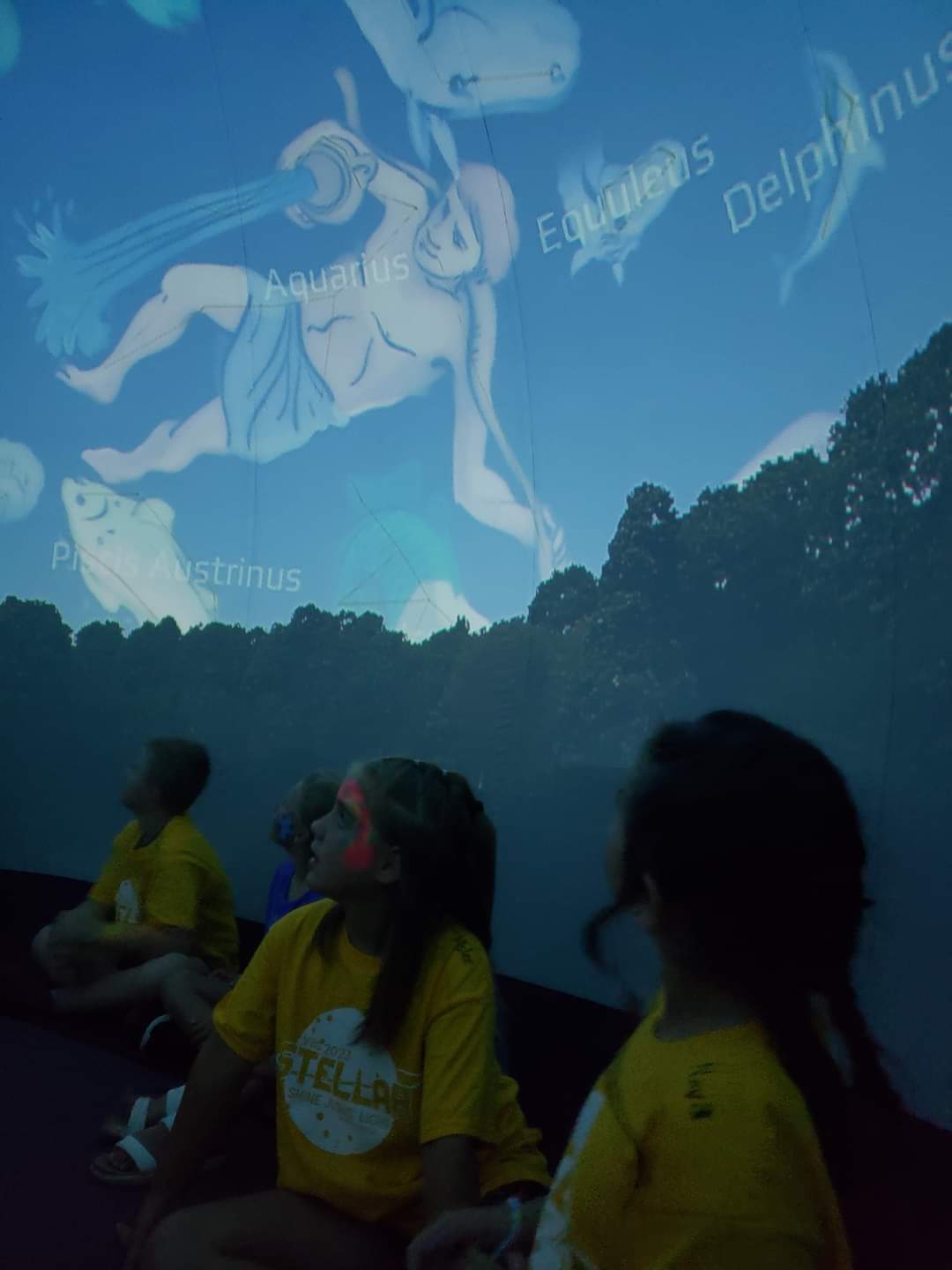 KWEC Perseid Meteor Shower Watch Party participants enjoy hearing stories from the night sky in the inflatable planetarium.