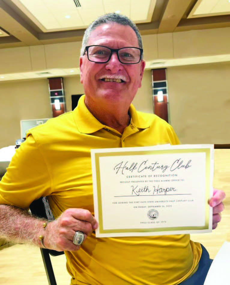 Keith Harper, FHSU Class of 1975, celebrates his induction into the university's Half Century Club